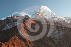 Machapuchare mountain in big white clouds. Nepal.