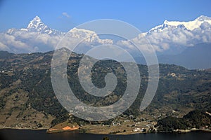 The Machhapuchhre (Fishtail) towering above Phewa Lake photo