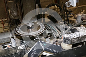 A machine adjusts a PVC window frame in a carpentry