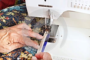Machine binding a quilt.