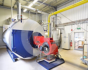 Machine boiler for heating water in an industrial plant