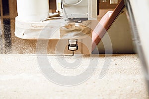 Machine with computer numerical control for cutting wood with various router bits.