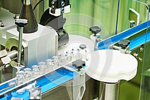 Machine conveyor with glass bottles ampoules