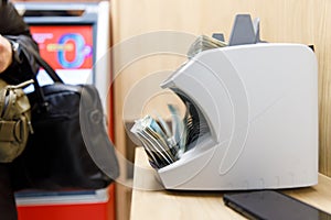 a machine that counts bills in a bank branch
