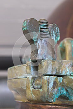 Machine detail, screw, brass, copper, verdigris photo
