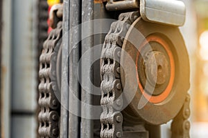 Machine engine chain with cog wheel part of forklift truck