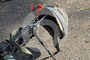 Machine gun and helmet photo