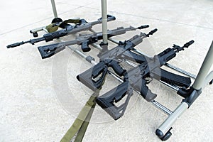 Machine guns on a metal rack. Automatic firearms for waging war and protecting the territory of the state. Selective focus photo