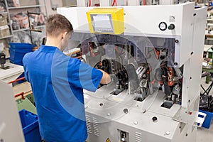 Machine for inserting backdrops. Shoe production