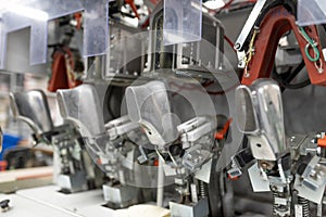 Machine for inserting backdrops. Shoe production