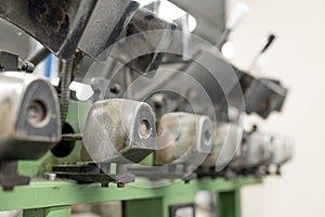 Machine for inserting backdrops. Shoe production