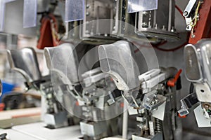 Machine for inserting backdrops. Shoe production