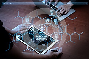 top view of two colleagues discussing data with new modern computer laptop and pro digital tablet with digital business strategy