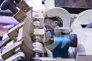 Machine making metal key. locksmith