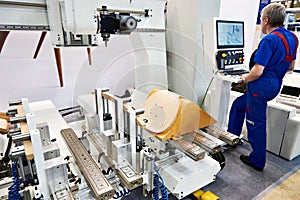 Machine for manufacture of chairs and worker