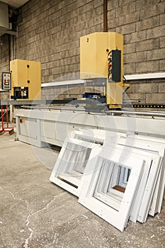 A machine mass-produces pvc frames for window construction