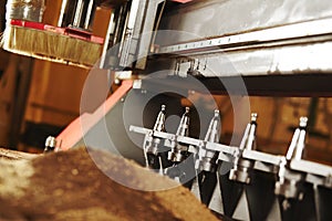 Machine with numerical control for cutting wood with various router bits.