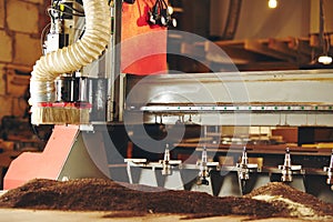 Machine with numerical control for cutting wood with various router bits.
