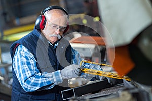 machine operator making steel bars
