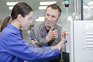 machine operator taking with factory supervisor