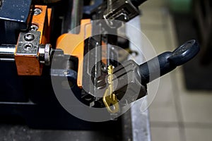 Machine production of duplicate metal key.