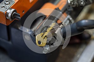 Machine production of duplicate metal key.