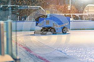 machine for resurfacing ice. Skate rink ice cleaner. Work service process during snowfall. Ice resurfacer