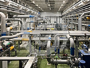 Machine room with industrial compressors and pipelines