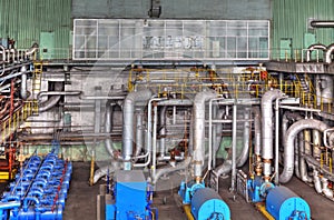 Machine room in thermal power plant with generators and turbines