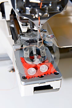 Machine for sewing on buttons of electric type