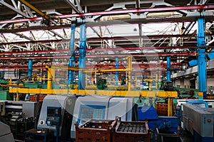 Machine shop of metallurgical works indoors room. Machining of metal by cutting on a turning and milling machine. Industrial