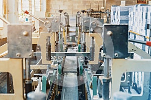 Machine for stitching sheets of paper in the printing. Magazine, brochure, book. Production of printed products. Vintage