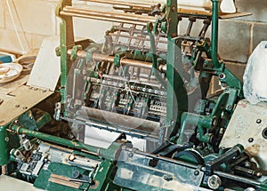 Machine for stitching sheets of paper in the printing. Magazine, brochure, book. Production of printed products. Vintage