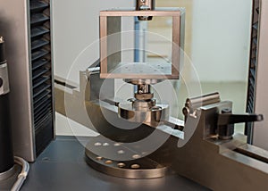 Machine for testing samples for tensile strength