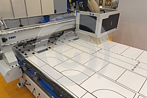 Machine tools format cutting are cut chipboard furniture in the shop