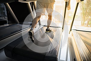 Machine treadmill with people running closeup at fitness gym