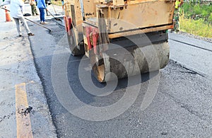 Machine working of asphalt road construction