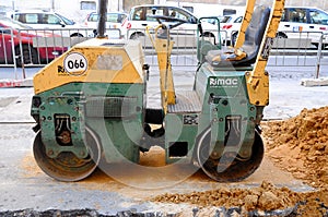 Machine working of asphalt road construction