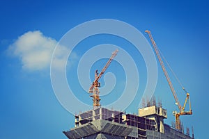 Machinery crane working in construction site