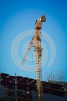 Machinery crane working in construction site building