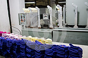 Machinery and equipment in a spinning production company interior design. Textile fabric