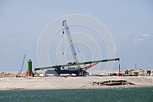 Machines in the harbour Europoort in Holland