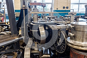 the machines are in use in the room of the factory