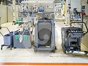 Machines for washing floors in production facilities