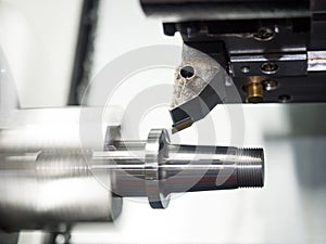 Machining automotive part by cnc turning machine