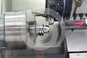 Machining automotive part by cnc turning machine