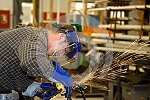 Machinist Grinding Metal