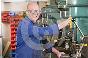 Machinist working on machine