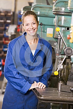 Machinist working on machine