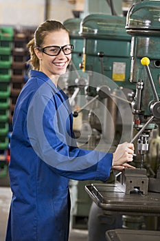 Machinist working on machine